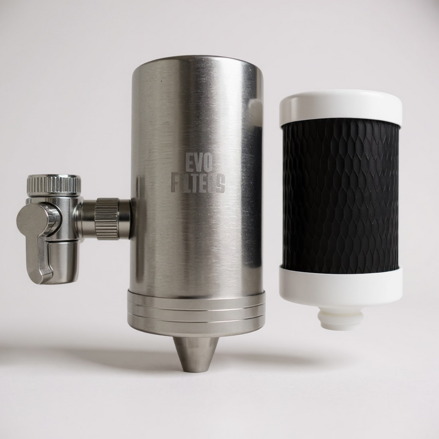 Metal filter housing with a black filter on a white background